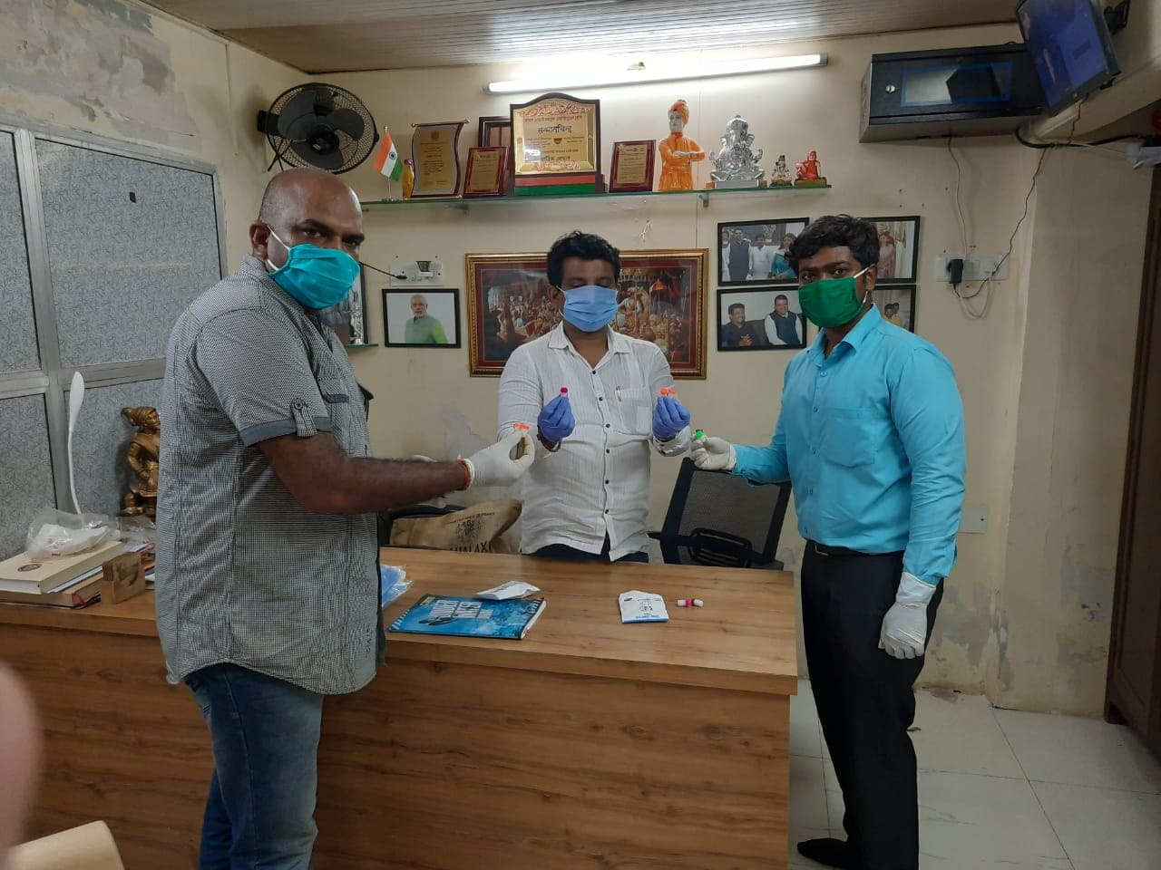Clinicians consulting inside a camp room